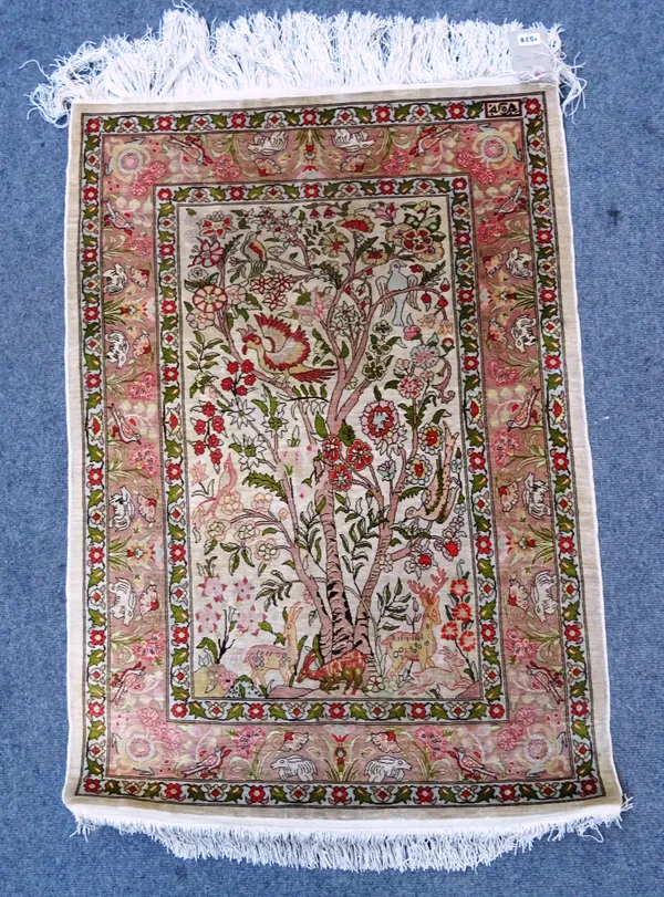 A silk Kayseri rug, West Anatolia, stylised tree decoration with roosting birds on a pale cream ground, 153cm x 75cm.