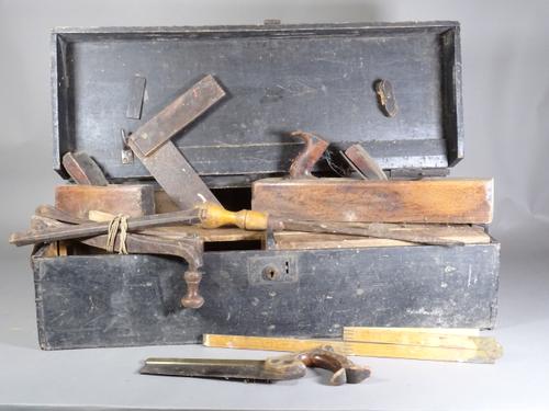 A quantity of tools in a stained pine box.  S3B
