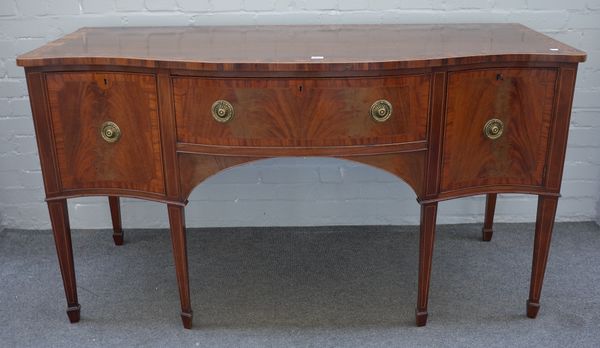 A George III marquetry inlaid mahogany serpentine sideboard with three frieze drawers on tapering square supports, 158cm wide x 87cm high x 67cm deep.