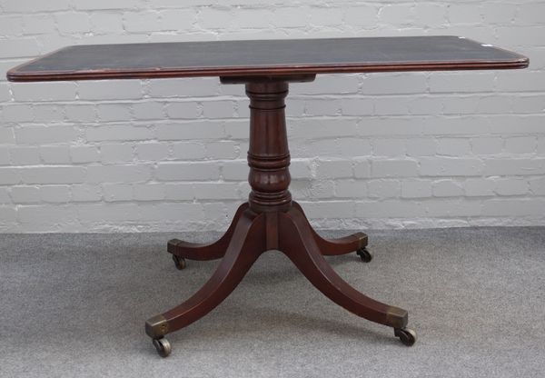 A William IV mahogany and rosewood centre table, the rounded rectangular top on turned column and four downswept supports, stamped with William IV Roy