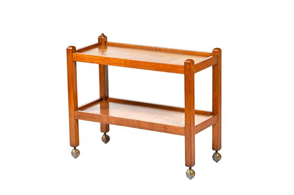 Robert 'Mouseman' Thompson; an oak rectangular two tier serving trolley, 86cm wide x 73cm high x 39cm deep. Illustrated