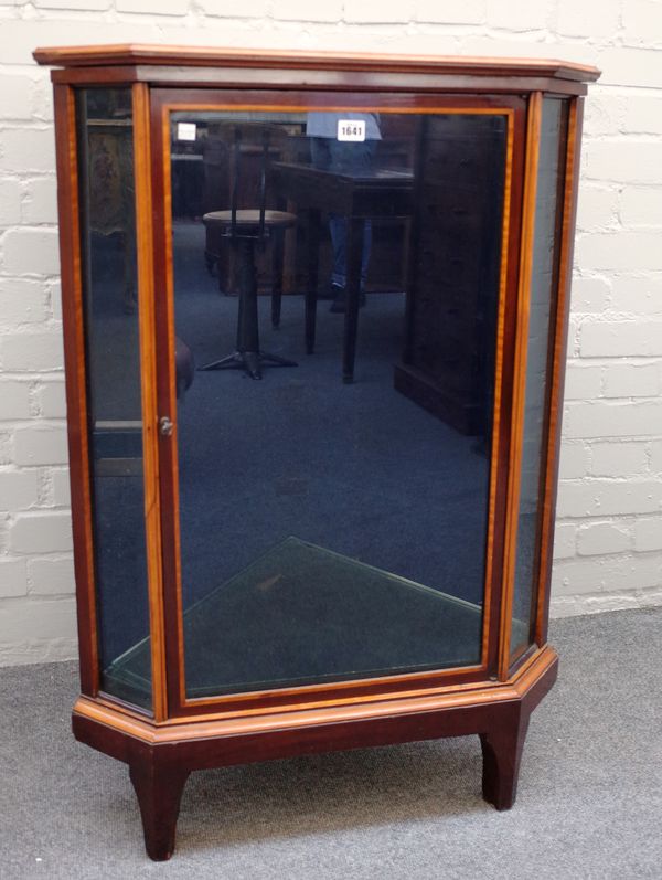 A late 19th century satinwood banded mahogany floor standing glazed corner cupboard on bracket feet, 70cm wide x 100cm high x 46cm deep.