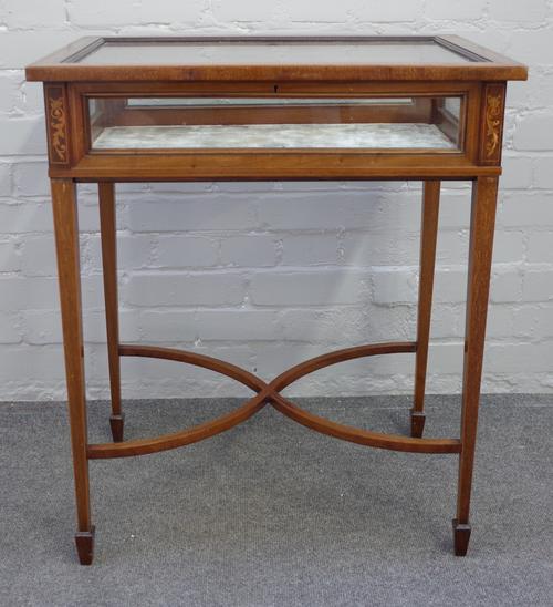 An Edwardian marquetry inlaid mahogany bijouterie table on tapering square supports, united by 'X' frame stretcher, 62cm wide x 74cm high x 43cm deep.