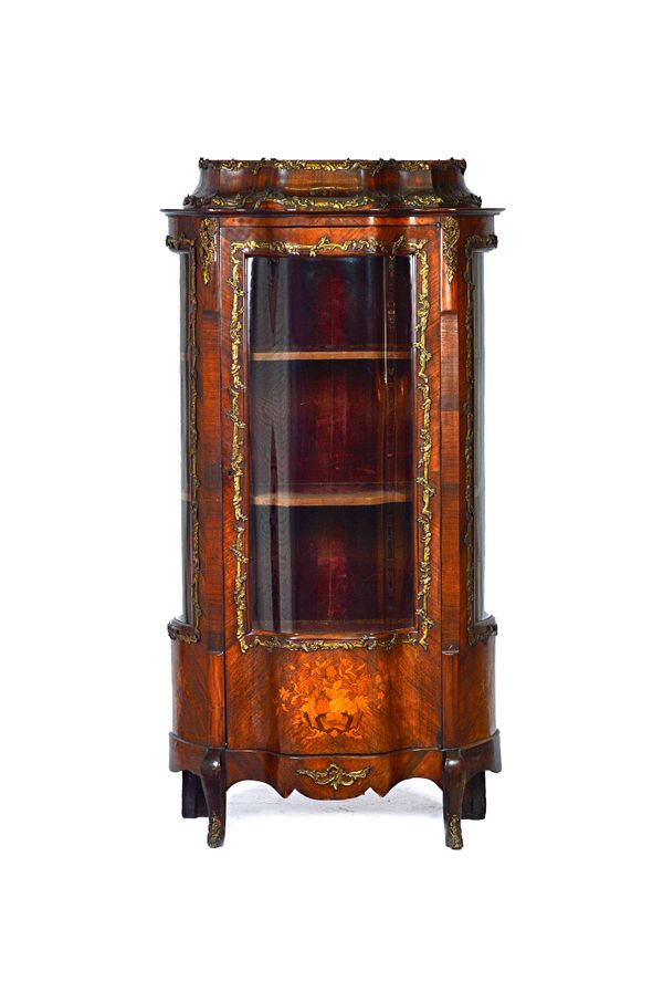 A late 19th century French gilt metal mounted marquetry inlaid rosewood display cabinet, the stepped caddy top over glazed serpentine door, flanked by