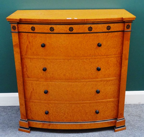 A Biedermeier style part ebonised bird's eye maple bowfront chest of five long drawers, on out stepped block feet, 96cm wide x 99cm high x 48cm deep.