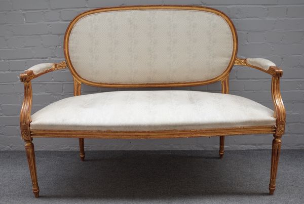 A Louis XVI style salon suite comprising; open arm sofa, 135cm wide x 100cm high, pair of open armchairs, 60cm x 96cm and four side chairs, 51cm wide