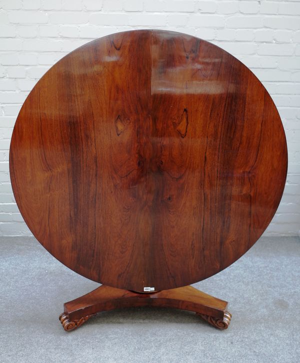 A William IV rosewood centre table, the circular snap top on octagonal column and three scroll feet, 122cm diameter x 72cm high.