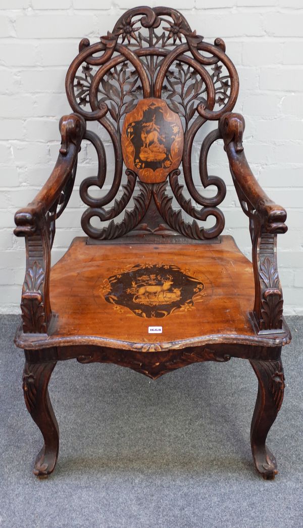 A 19th century marquetry inlaid Black Forest/Swiss musical open armchair on scroll supports, 66cm wide x 109cm high.