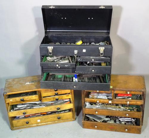 A group of three watchmakers tool chests containing tools.  BAY 3