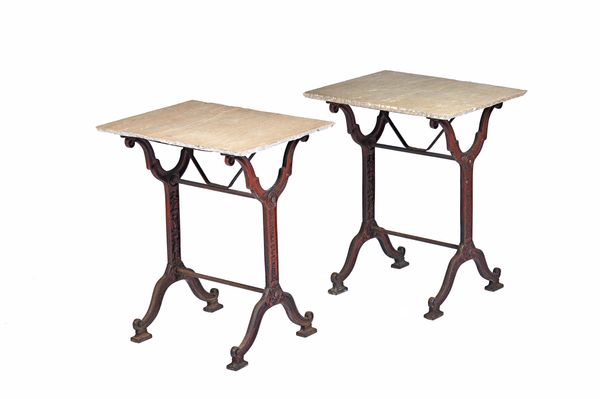 A pair of occasional tables, each with split stone rectangular tops on cast iron trestle bases, relief cast CASTACNE & J CHARLIONAIS, TOULOUSE, 60cm w