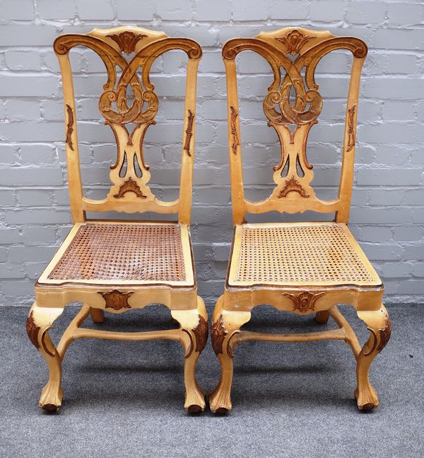 A set of six 18th century Venetian style parcel gilt cream painted dining chairs on ball and claw feet, 52cm wide x 107cm high (6).