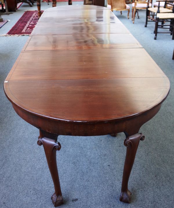 An 18th century and later mahogany extending dining table with pair of 'D' end sections, centre drop flap and pair of extra leaves, 112cm wide x 369cm