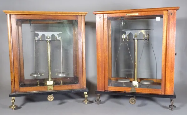 A cased set of chemists scales and another similar, (2). E10