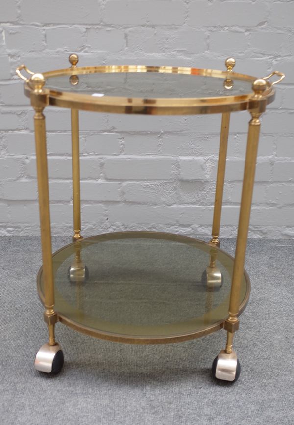 A mid-20th century lacquered brass circular two tier serving trolley, 55cm diameter x 61cm high.