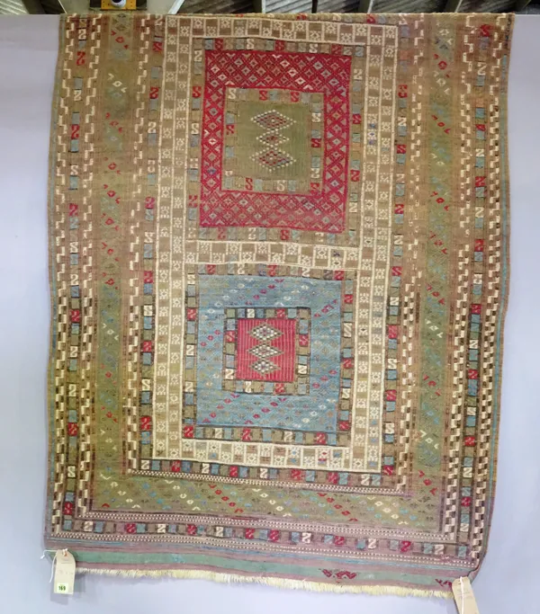 A flat weave tribal rug 176cm x 110cm and a machine made Turkman mat, 108cm x 67cm, (2).  H8