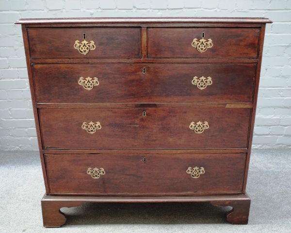 A mid-18th century mahogany and oak chest of two short and three long graduated drawers, on bracket feet, 103cm wide x 101cm high x 53cm deep.