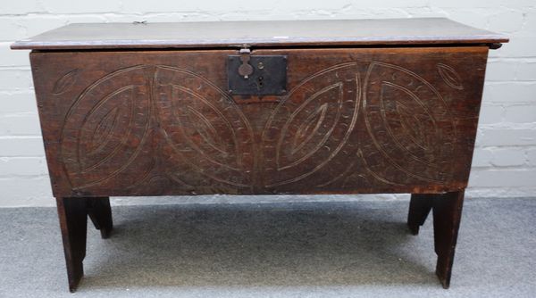 A 17th century oak five plank coffer on slab end supports, 109cm wide x 67cm high x 39cm deep.