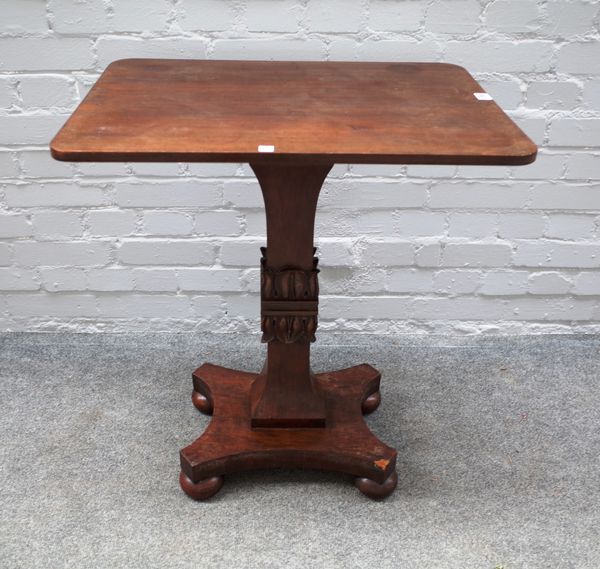 A George IV mahogany occasional table, the rectangular top on opposing lappet carved square column and quatrefoil platform, 63cm wide x 73cm high x 45