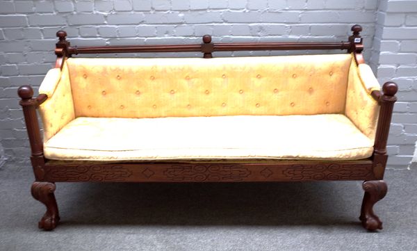 A 19th century mahogany framed hall bench, with fluted turned crest rail and arm supports, on claw and ball feet, 183cm wide x 97cm high x 60cm deep.