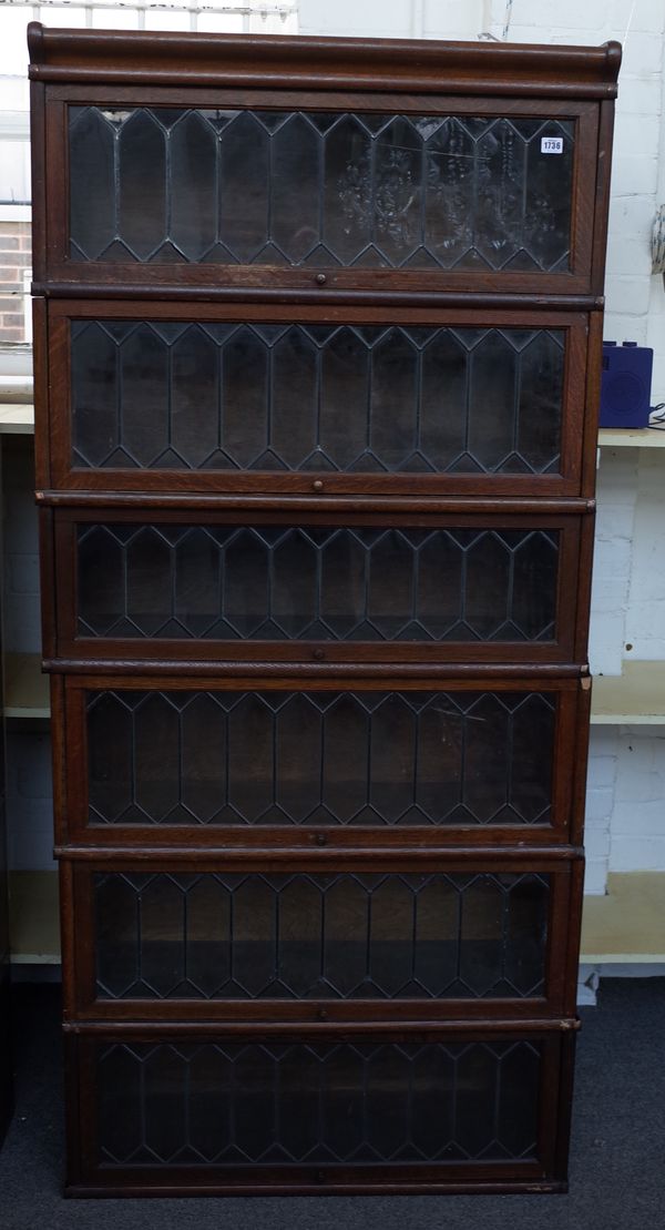 Six sections of Globe Wernicke bookcase with leaded glass doors to include cornice section, 86cm wide x 28cm deep.