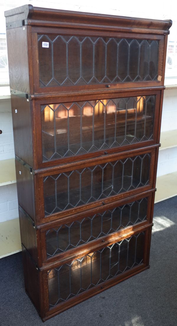 Six sections of Globe Wernicke bookcase with leaded glass doors to include cornice section, 86cm wide x 28cm deep.