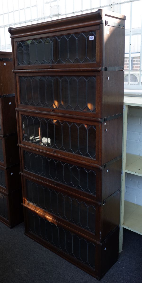 Five sections of Globe Wernicke bookcase with leaded glass doors to include cornice section, 86cm wide x 28cm deep.