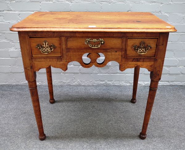 A mid-19th century walnut lowboy with two drawers about the pierced frieze on tapering turned supports, 79cm wide x 71cm high x 47cm deep.