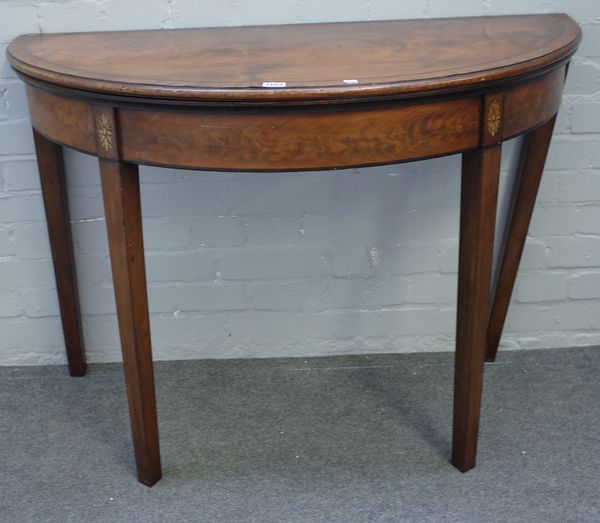 A George III mahogany semi-elliptic card table on tapering square supports, 106cm wide x 77cm high x 52cm deep.