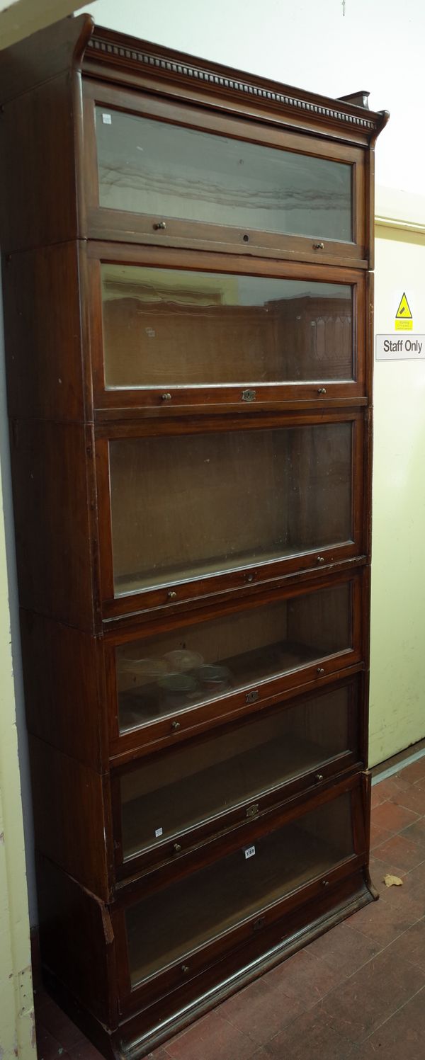 The Lebus Bookcase, a walnut six tier bookcase on plinth base, 89cm wide x 210cm high.