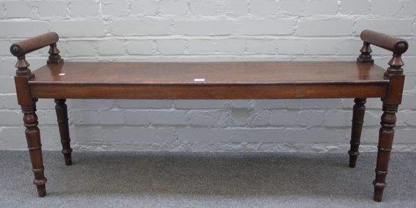 A 19th century rectangular mahogany window seat with turned end stops and supports, 56cm high x 30cm deep.