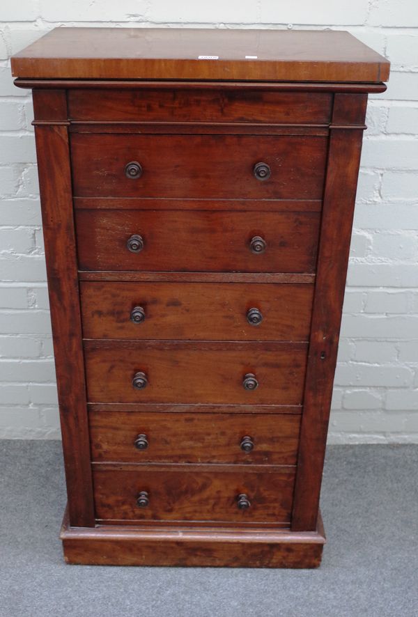 A Victorian mahogany secretaire Wellington chest, the fitted double fronted drawer over four further drawers enclosed by locking bar, 61cm wide x 114c