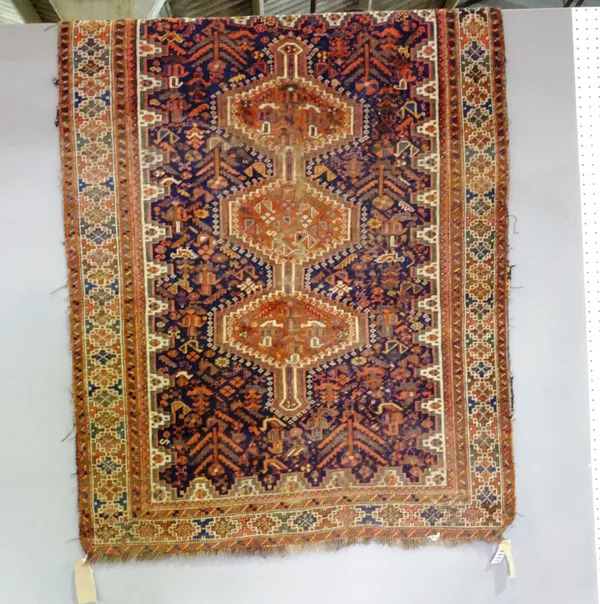 A Shiraz or Kashgai rug, stepped triple pole medallion within dark ground with bird and floral decoration, 150 x 111cms.  H8