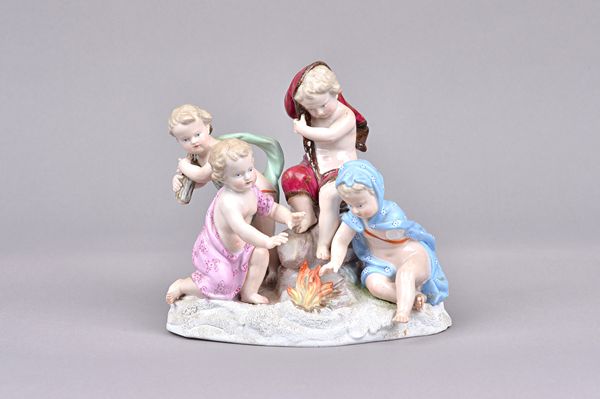 A Meissen porcelain allegorical figure group, late 19th century, emblematic of Winter, depicting four putto around a fire, on a snow covered shaped ba