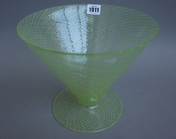 A Continental green glass footed bowl of conical form early 20th century, with two tone green/yellow line decoration and raised geometric detail, 20.5