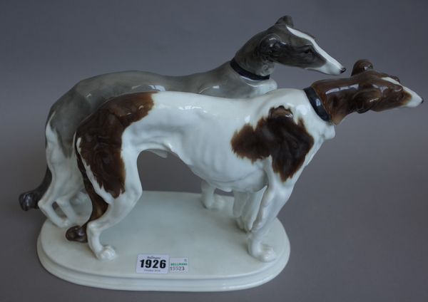 A Karl Ens for Volkstedt porcelain dog group depicting two Borzoi hounds on a raised integral oval base, green printed mark, 40cm wide.