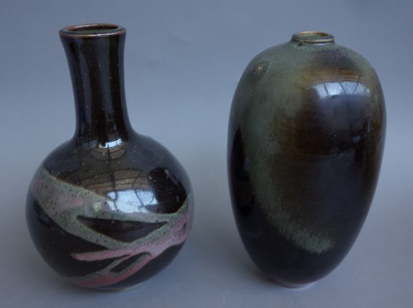 A studio pottery vase of ovoid form, late 20th century, Tenmoku style glaze,  indistinctly signed to the base (20cm high); and one further similarly d