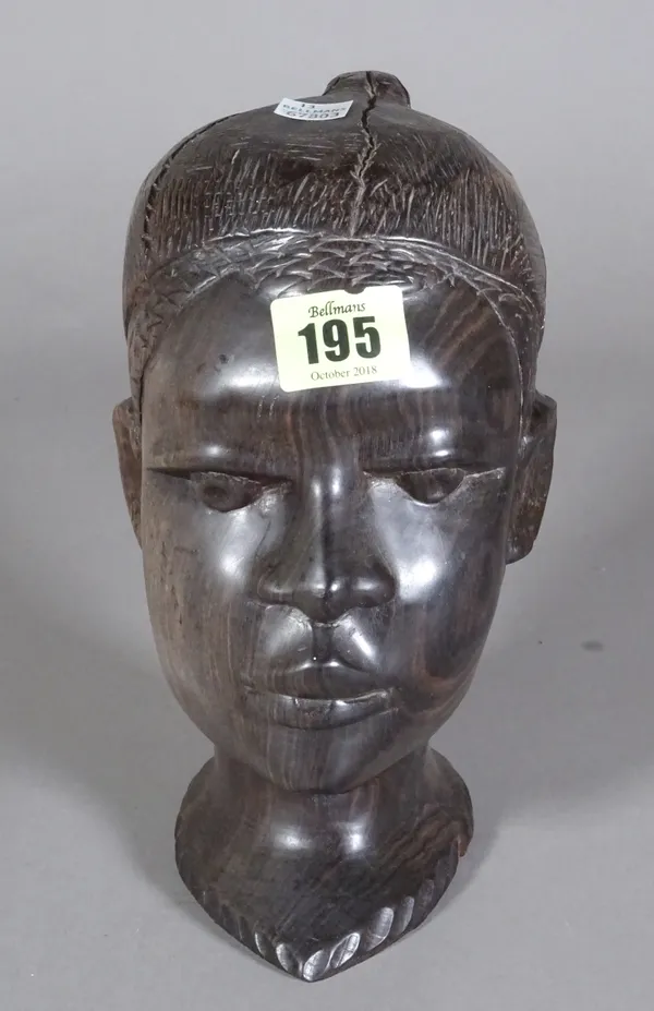 A 20th century carved hardwood tribal head, 161cm wide.   CAB