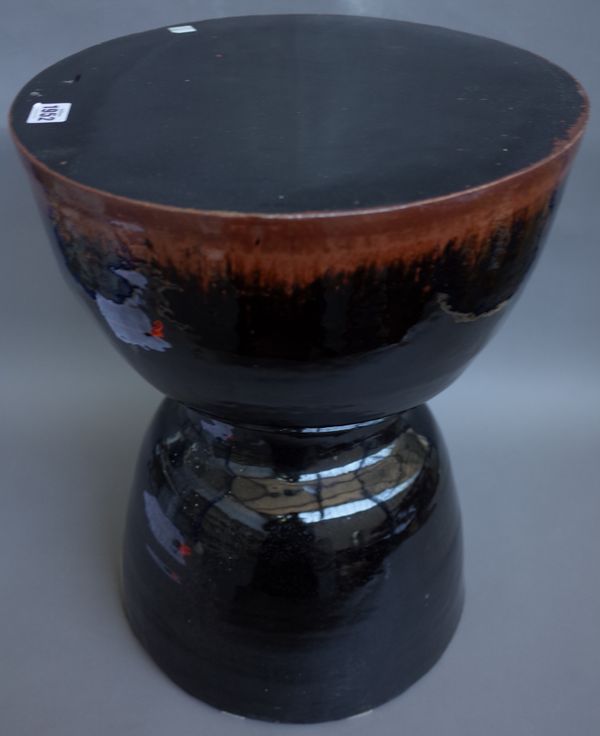 A Bernard Leach style garden seat of inverted goblet form, modern, brown tenmoku glaze, unsigned, 50cm high.