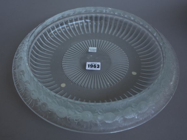 A modern Lalique clear and frosted crystal bowl, 'Marguerites' pattern, etched 'Lalique France' to base. (a.f.) 36cm diameter.