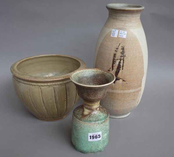 A mottled green studio pottery vase of cylindrical waisted form, indistinctly stamped (18cm high), a large stoneware jug stamped 'TP' (32cm high), a S