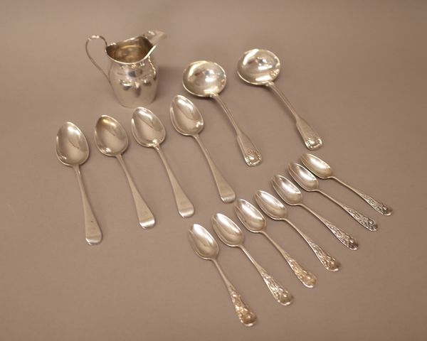 Silver, comprising; a helmet shaped milk jug, the hallmark rubbed, a pair of double struck fiddle, thread and shell pattern sauce ladles, London 1841,