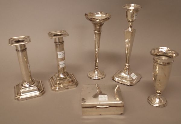 Silver and silver mounted wares, comprising; a pair of candlesticks, each raised on a cut cornered square base, Sheffield 1907, a single candlestick,