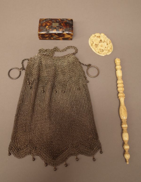 A silver chain mesh bag, having bead drops, with two loop ring fittings, detailed to one ring Solid Silver, weight 164 gms, a Victorian tortoiseshell