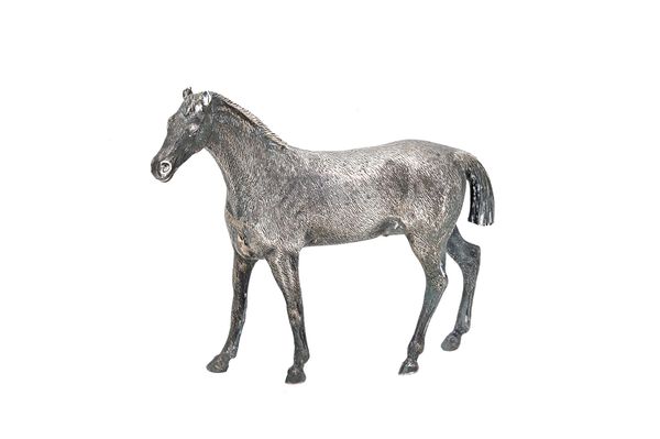 A silver model of a standing horse, London 1974, height 7.8cm, gross weight 108 gms. Illustrated