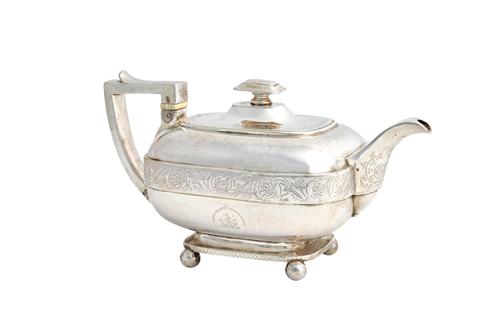 A George III silver three piece tea set, comprising; a teapot, a twin handled sugar bowl and a milk jug, each piece of curved rectangular form, decora