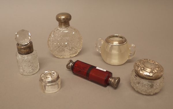 A silver mounted glass twin handled match striking stand, London 1900, a Victorian silver mounted red glass double ended scent cum smelling salts bott