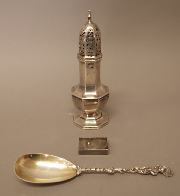 Silver, comprising; an octagonal sugar caster, raised on an octagonal foot, Sheffield 1936, a Victorian spoon, having a pear shaped bowl, the cast han