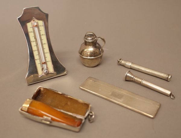 Silver and silver mounted wares, comprising; a travelling comb with engine turned decoration, Birmingham 1956, a slide action pencil, a cigar pricker,