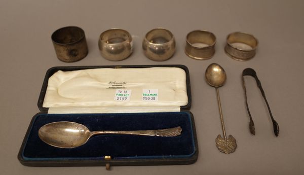 Silver, comprising; a pair of napkin rings, Sheffield 1923, three further napkin rings, a pair of sugar tongs and a christening spoon, Sheffield 1925,