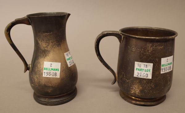 Silver, comprising; a jug of baluster form raised on a circular foot, Sheffield 1919 and a christening mug, Birmingham 1930, combined weight 300 gms.